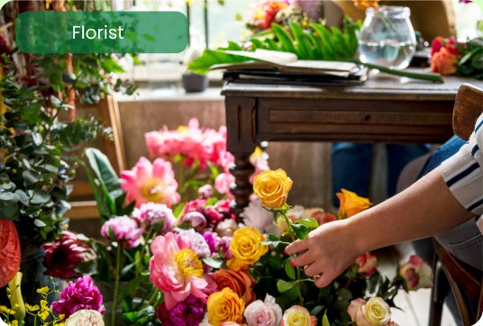 Florist arranging colourful flowers